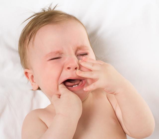 square of A Teething Child is Rarely Happy to Be Experiencing the Process